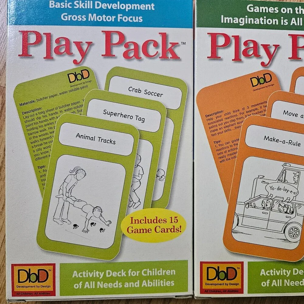 Kids Play Pack cards, Scrabble Slam, Guess Who game, crayons